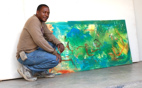 Kingsley Kapobe next to his favorite piece: Valley of Peace 